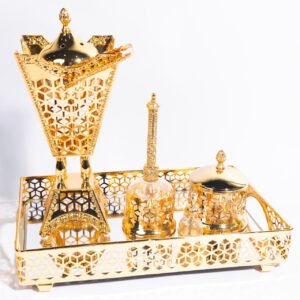 A gift for your loved ones, consisting of a golden tray with a large incense burner, a penny for incense, and tongs.