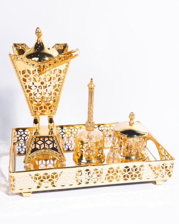 A gift for your loved ones, consisting of a golden tray with a large incense burner, a penny for incense, and tongs.