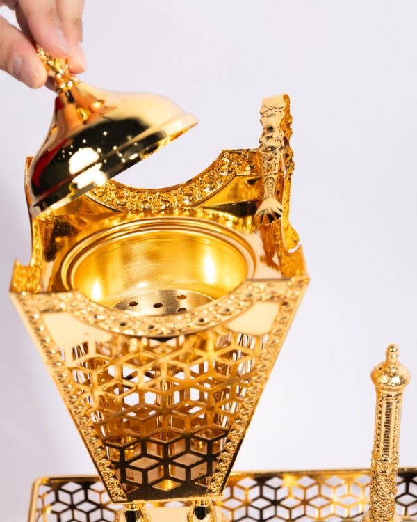 A gift for your loved ones, consisting of a golden tray with a large incense burner, a penny for incense, and tongs. - Image 2